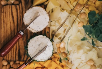 white and brown round decor beside red and yellow hand tool