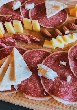 sliced meat on brown wooden chopping board